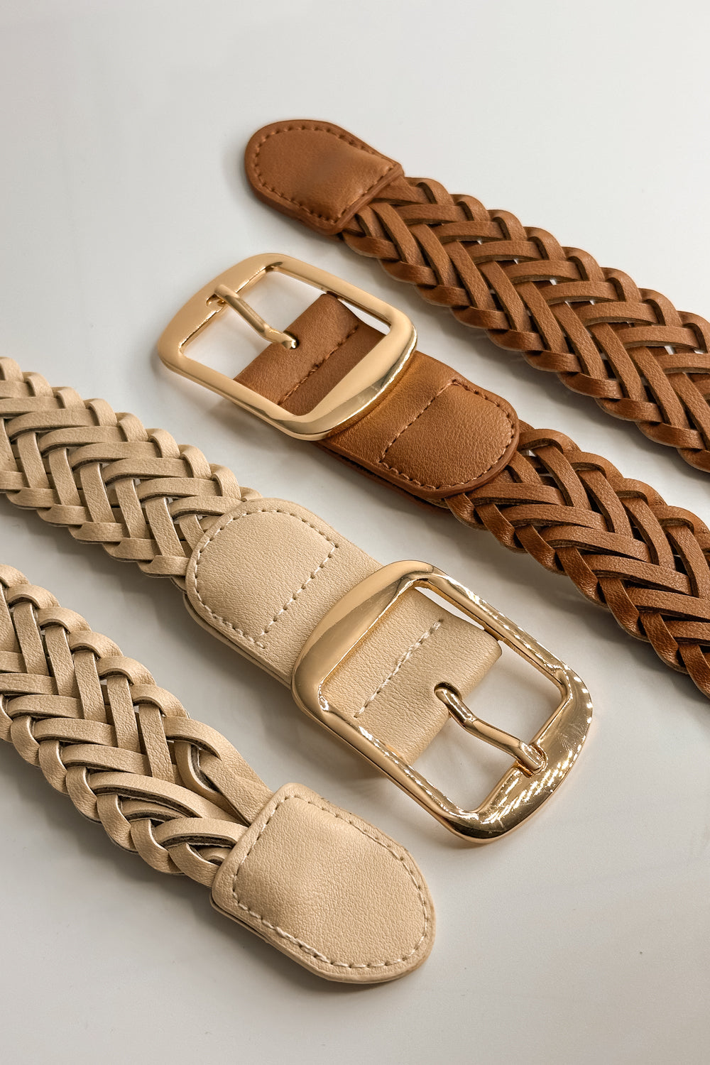 Flat lay view of the Everly Braided Adjustable Belt in Brown and Ivory which features Leather Fabric, Braided Details, Gold Adjustable Buckle
