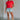 Full body view of female model wearing the Evie Red Coral Short Sleeve Top which features Coral Red Cotton Fabric, Cropped Waist with Raw Hem, Round Neckline and Short Sleeves