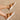 Side view of female model wearing the VIIBE Twist Slide Flat Sandal in Honest Beige/Sea Salt which features Lightweight Puff Light Brown Fabric, Twisted Straps, Leather Lining, White 1" Platform Sole and Slide-On Style