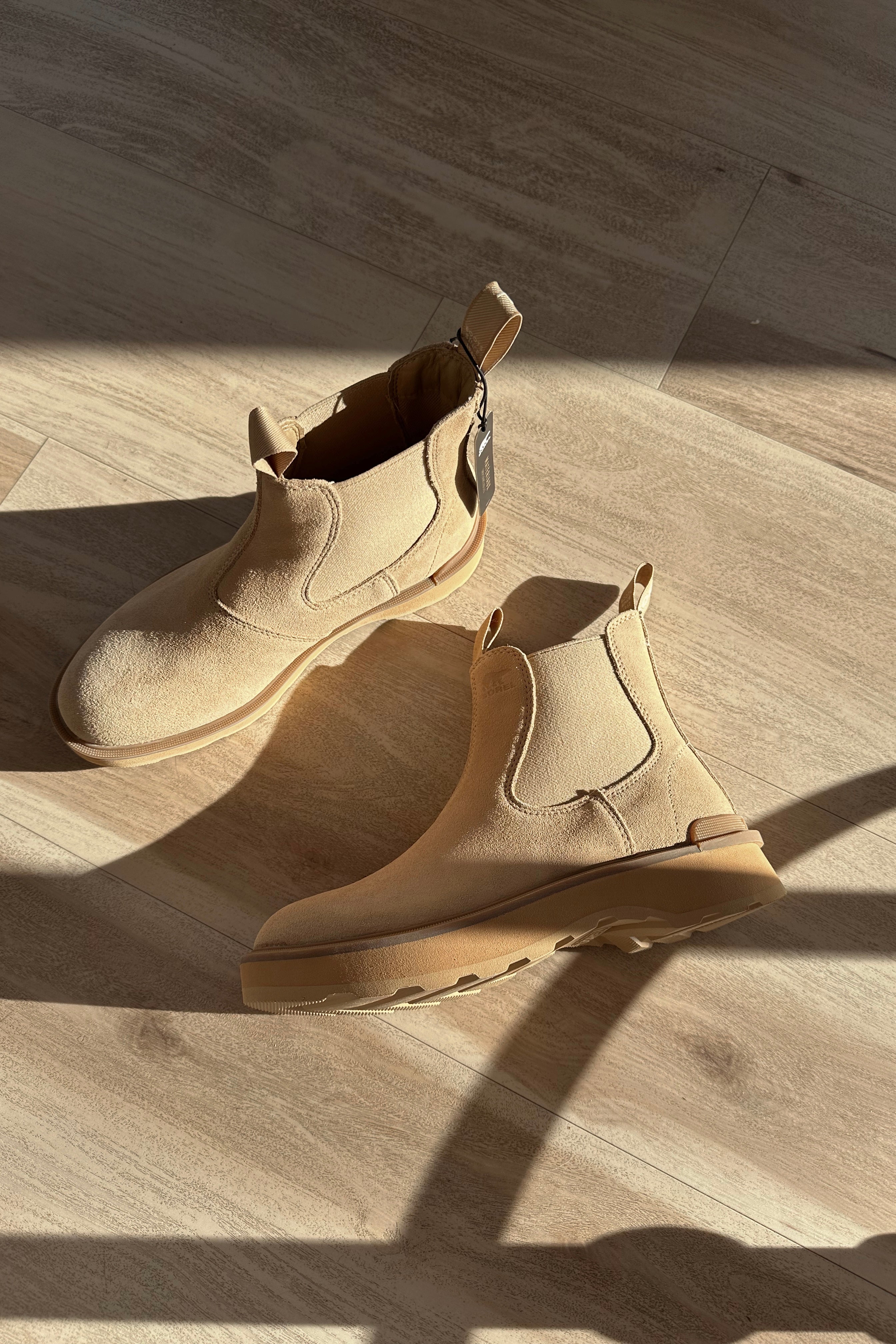 Ariel view of the Hi-Line Chelsea Boot in Canoe Ceramic which features tan waterproof suede, monochrome lightweight sole, stretch panels on each side, pull tabs, round toe, 1 inch platform height and 1 inch heel height
