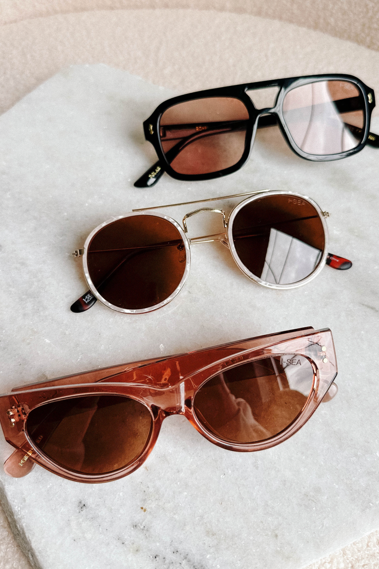 image of 3 sunglasses on a white background