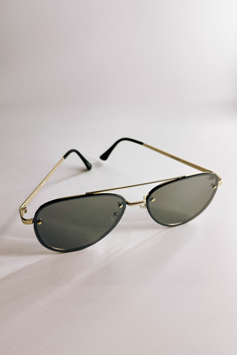 Front view of the I-Sea: River Sunglasses in Gold & Silver which features gold frames with black details and silver mirror lenses.