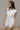 Brynlee White Smocked Waist Sleeveless Romper- frontal side view