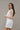 Brynlee White Smocked Waist Sleeveless Romper- full side view