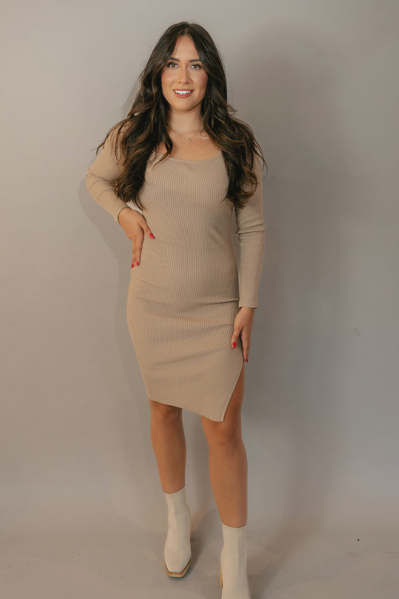 Full body view of model wearing the Adeline Khaki Ribbed Long Sleeve Midi Dress which features khaki ribbed fabric, midi length, slits on each side, a square neckline, and long sleeves.