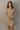 Front view of model wearing the Adeline Khaki Ribbed Long Sleeve Midi Dress which features khaki ribbed fabric, midi length, slits on each side, a square neckline, and long sleeves.