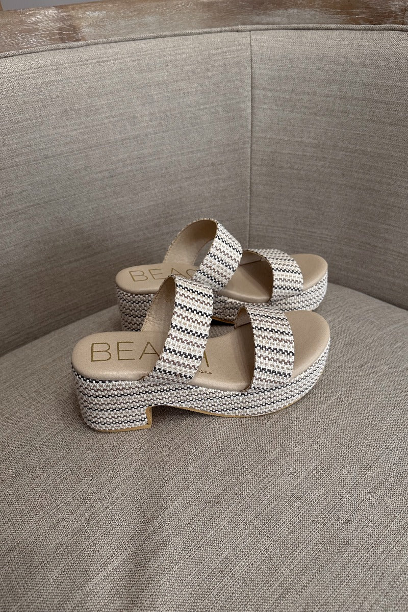 Side view of the Ocean Ave Platform Sandal in Ivory Mosaic which  features ivory, natural and brown knit fabric, two straps, slide-on style, monochrome platform sole and block heel.