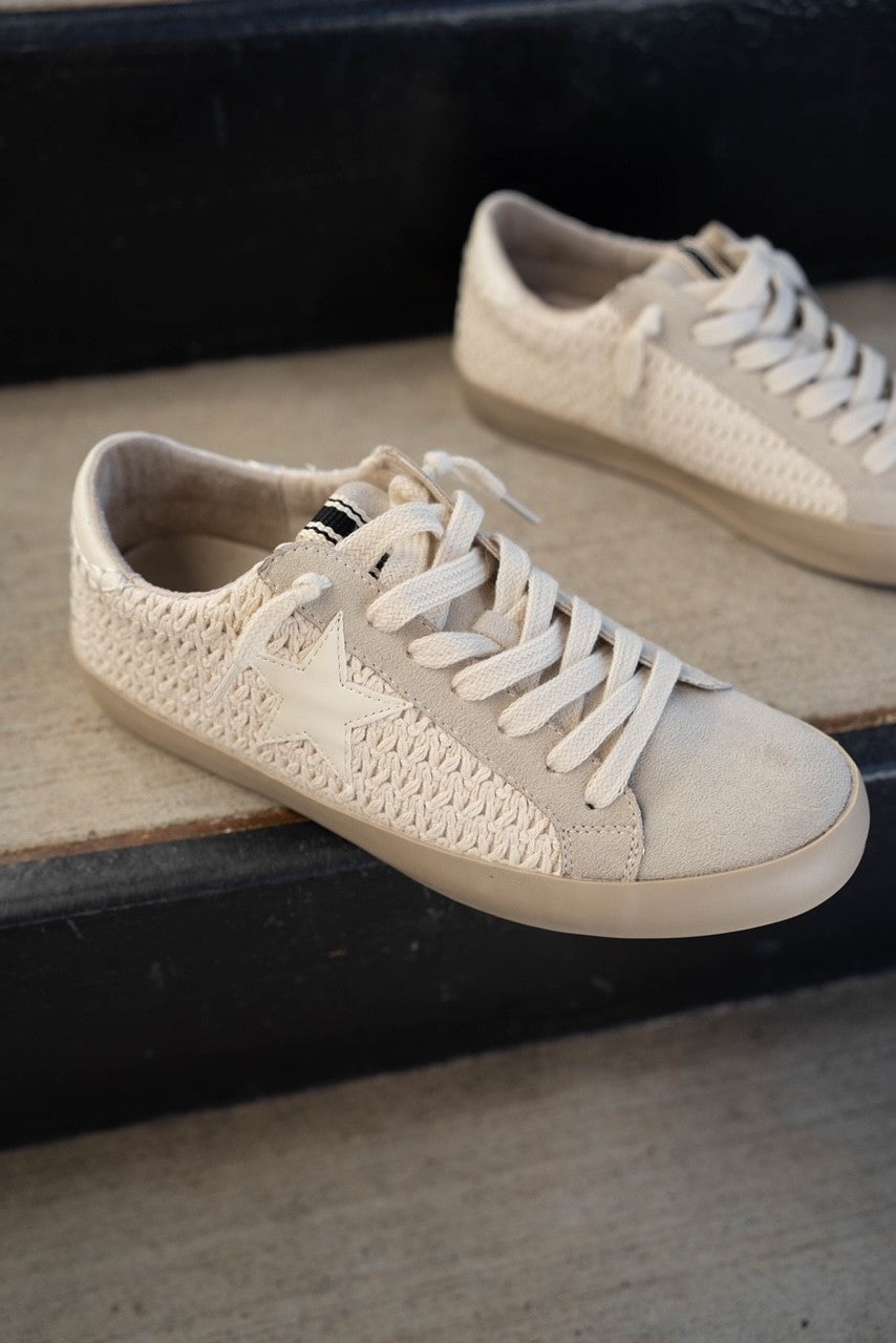 Front right angle view of Paula Sneaker in Bone Woven. Flat sole, pre-tied lace up details, monochrome woven details and white star detail.
