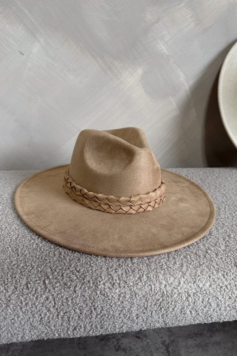 Front view of the Briley Camel Suede Brimmed Hat that has camel-colored suede material, a flat brim, braided band details, and inner tie size adjusters.