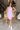 Full body view of model wearing the Out And About Dress In Lavender which features lavender knit fabric, ruched side details, midi length, lavender lining, a round neckline and a sleeveless design.