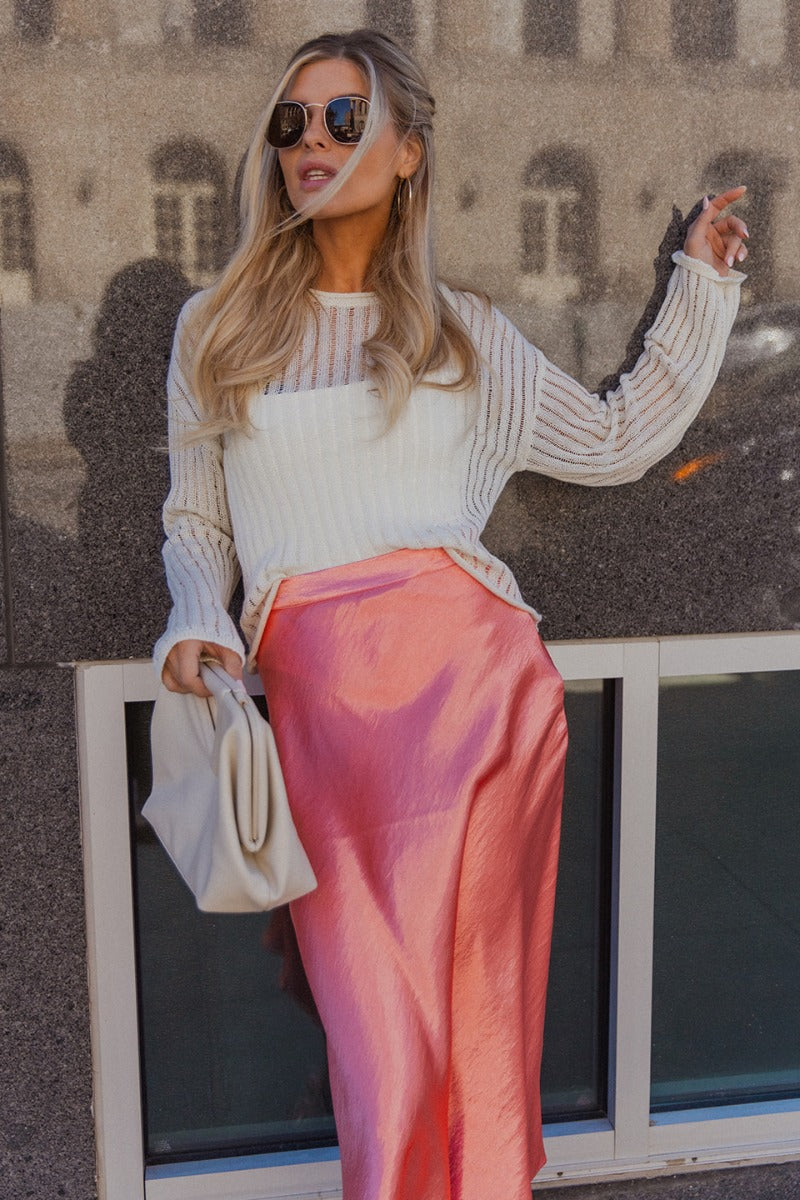Front view of model wearing the Leah Cream Striped Long Sleeve Top which features cream open knit fabric, monchrome stripe design, round neckline and long sleeves.