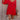 Front view of model wearing the Rowyn Red Short Sleeve Dress which features red rayon fabric, three tiered body style, ruffle hem, mini length, red lining, smocked waist, v-neckline with tie closure and short puff sleeves.