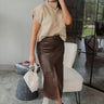 Full body front view of model wearing the Ready For It Mock Neck Top that has tan cable knit fabric, a cropped waist, one front chest pocket, a mock neck and short sleeves