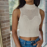 Front view of model wearing the I Go Back Tank in Natural which features cream chenille knit fabric, a high neckline and a sleeveless design.