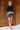 Full body view of model wearing the Zara Black & Silver Sequin Mini Skirt which features black sequin and silver sequin fabric, colorblock design, black lining, mini length and back zipper.