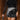 Front view of model wearing the Zara Black & Silver Sequin Mini Skirt which features black sequin and silver sequin fabric, colorblock design, black lining, mini length and back zipper.