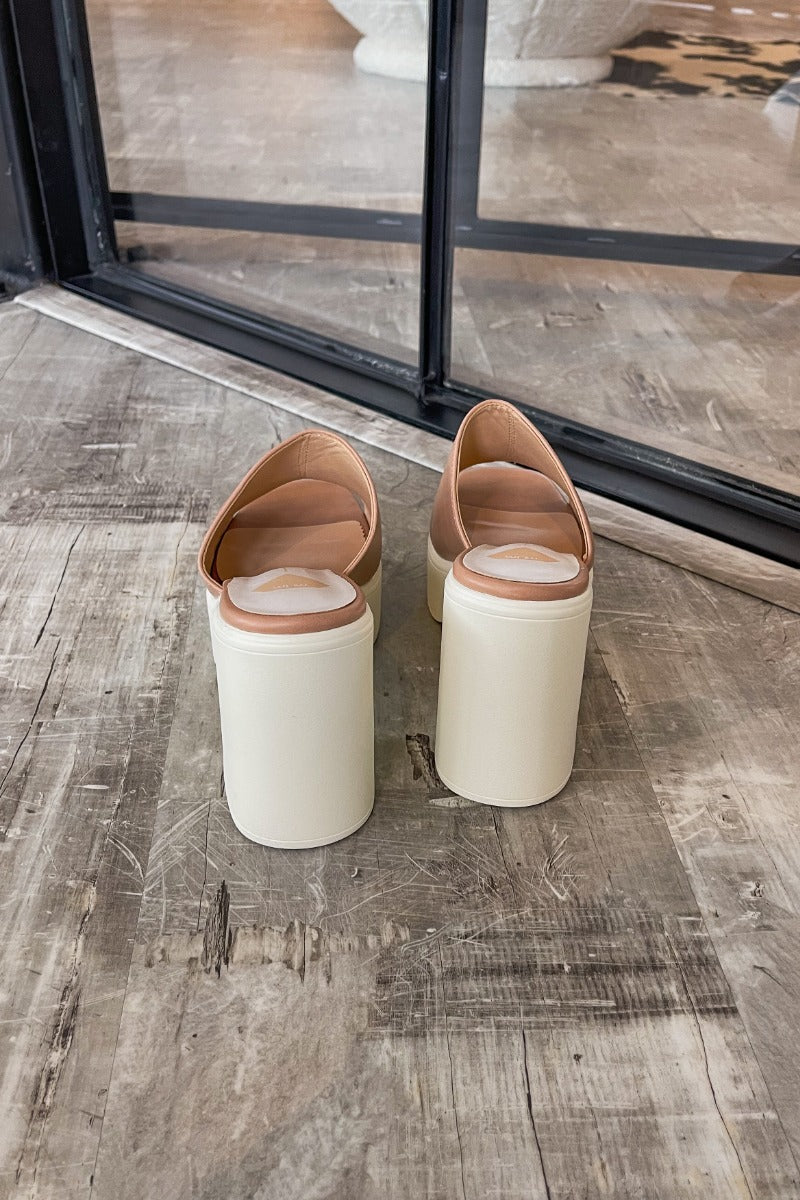Heel view of the Sienne Block Heel which features a slip-on style, two-tone design, white sole with a block heel and nude/pink upper.