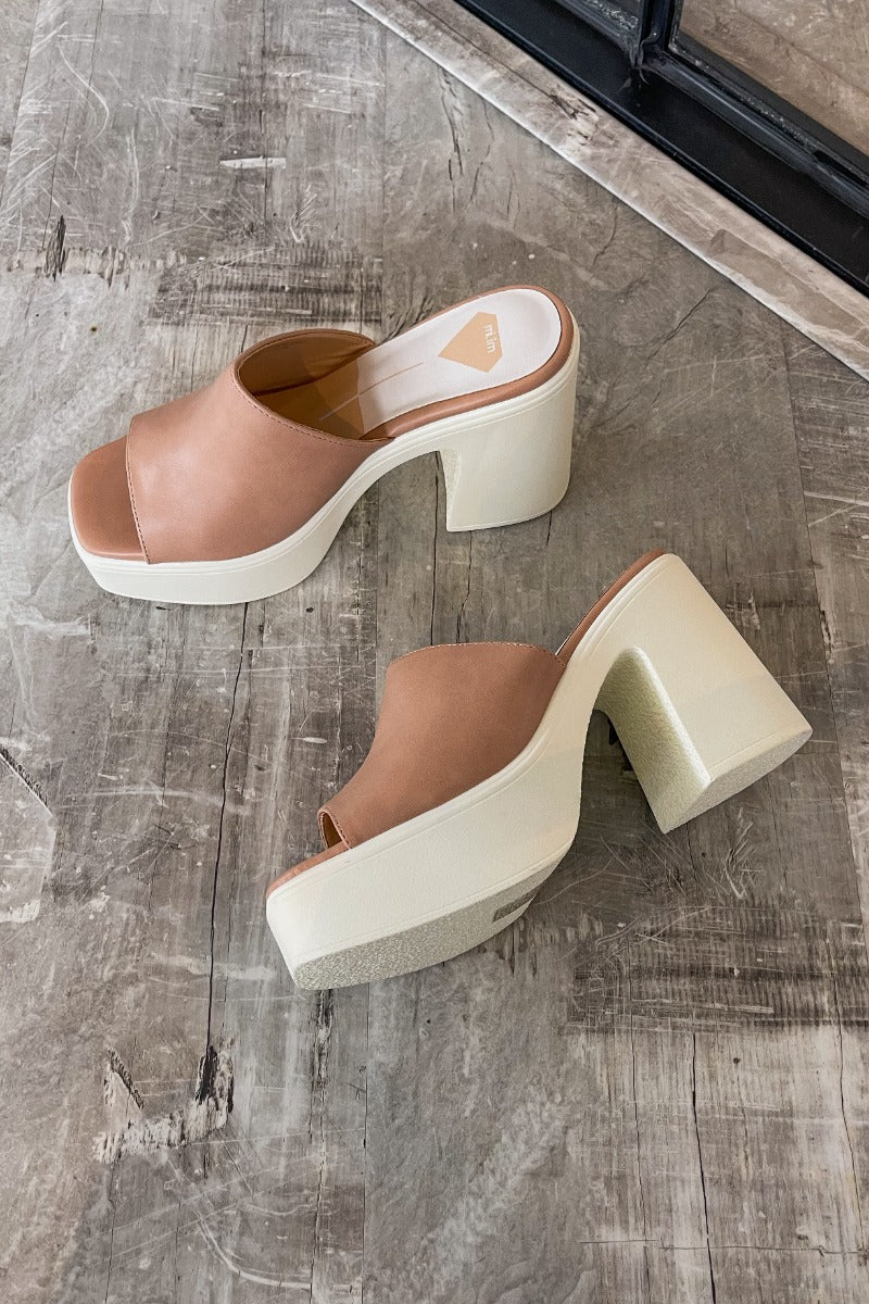 Ariel view of the Sienne Block Heel which features a slip-on style, two-tone design, white sole with a block heel and nude/pink upper.