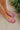 Ariel view of model wearing the Think Pink Sandals which features pink transparent coloring, light pink matte chain link details and slip on.