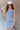 Front view of model wearing the Long Beach Dress that has light blue ribbed fabric, midi length, a round neckline, and thick straps.