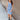 Full body front view of model wearing the Long Beach Dress that has light blue ribbed fabric, midi length, a round neckline, and thick straps.