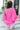 Back view of model wearing the Better Days Top in Pink which features fuchsia satin fabric, a round low neckline, and 3/4 flare sleeves.