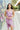 Front view of model wearing the Blaire Satin Midi Dress which features lavender satin fabric, midi length, a slit on the side, exterior boning and mesh details, pleated upper fabric, a sweetheart neckline, adjustable straps, and a monochromatic back zippe