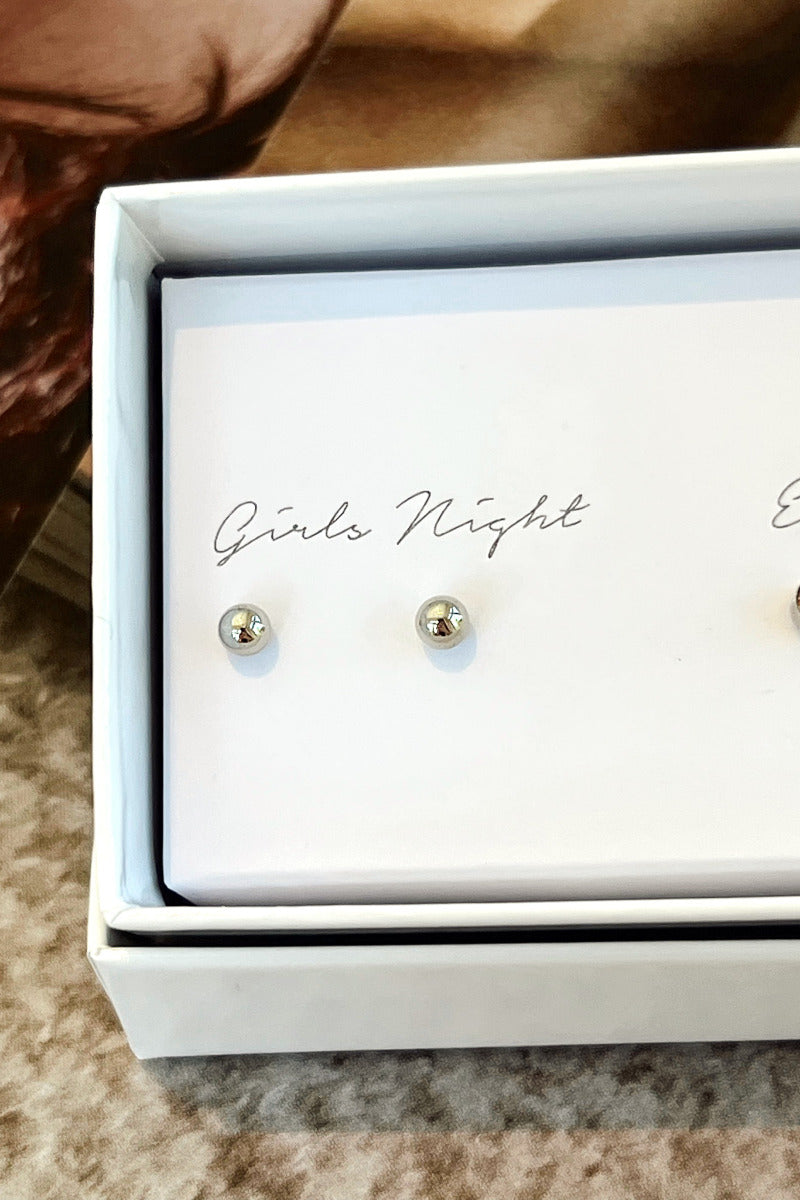 Close-up view of the 'girls night' silver sphere earrings.