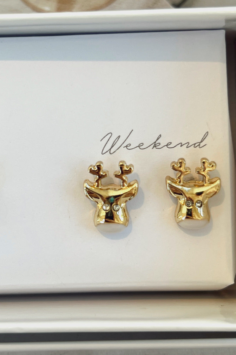 Close-up view of the 'weekend' gold reindeer earrings.