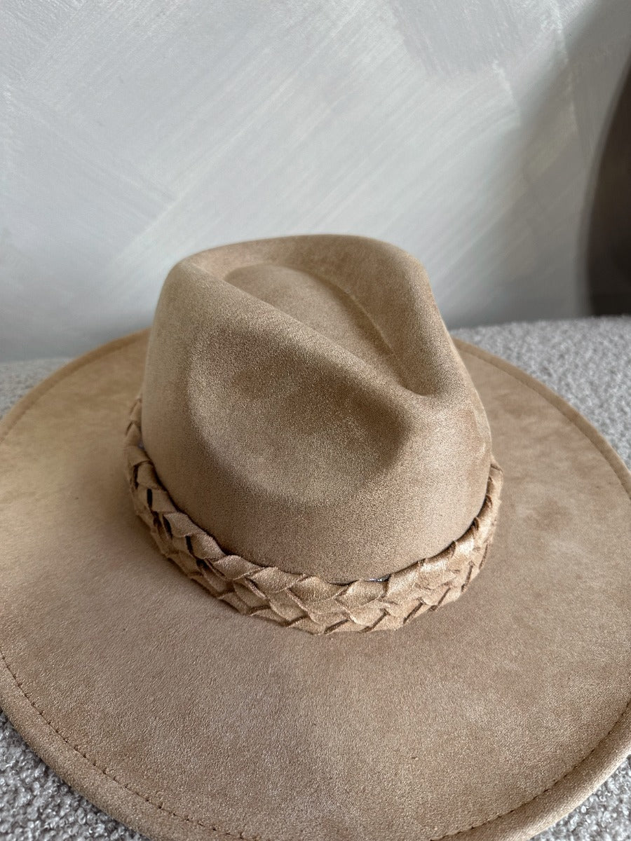 Top view of the Briley Camel Suede Brimmed Hat that has camel-colored suede material, a flat brim, braided band details, and inner tie size adjusters.
