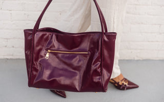 Doris Wine Patent Leather Purse - Held by Model