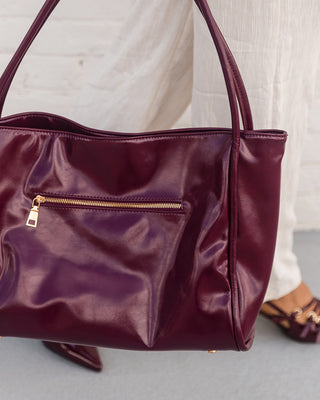 Doris Wine Patent Leather Purse - Held by Model