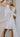 Melissa White Satin Bow Mini Dress- close up back view