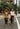 two models walking across cross walk