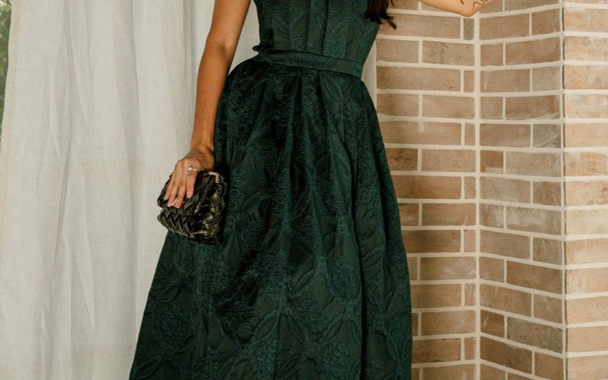 Lizard Thicket model wearing the Carmen Green Embroidered Midi Dress