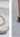 Image shows close up gold anklet against a white marble background next to an image of woman's ankle with a gold anklet and black sandal.