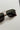 Regan Sunglasses in Gold & Black - flat lay - close up front view