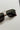 Regan Sunglasses in Gold & Black - flat lay - close up front view