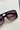 Kennedy Sunglasses in Black - flat lay - close up front view