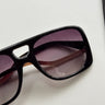 Kennedy Sunglasses in Black - flat lay - close up front view