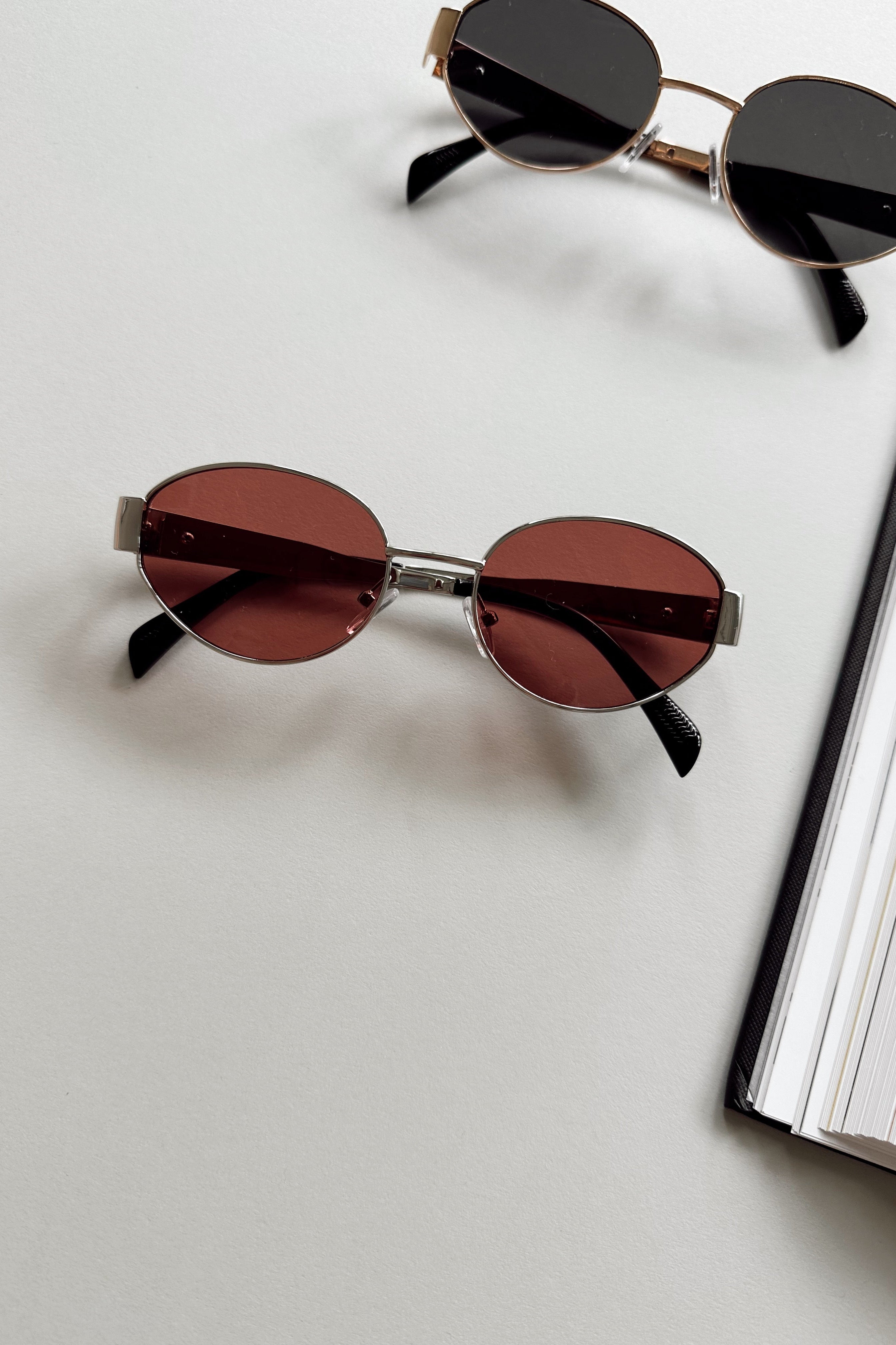 Clarissa Sunglasses in Silver & Pink - front view - flat -lay