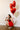 Amara Red Scalloped Mini Dress - side view of model squatting