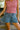 Evie Denim Tiered Flare Shorts- close up front view