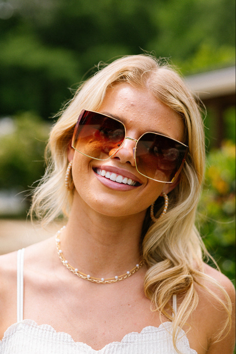 Serena Sunglasses in Gold & brown - front view on model