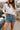 Margot Washed Denim Braided Shorts- close up front view