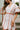 Camila Natural & Rust Scallop Mini Dress- close up front view