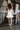 London White Ruffle Hem Romper- full body back view