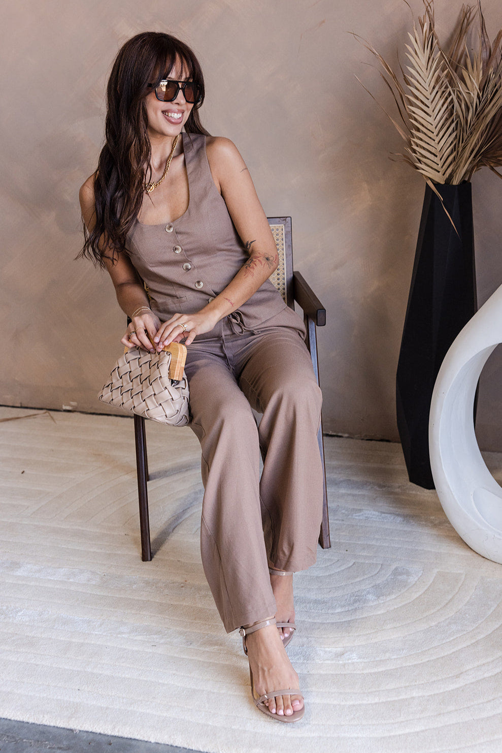 Chloe Mocha Linen Pants - model shown sitting - front view