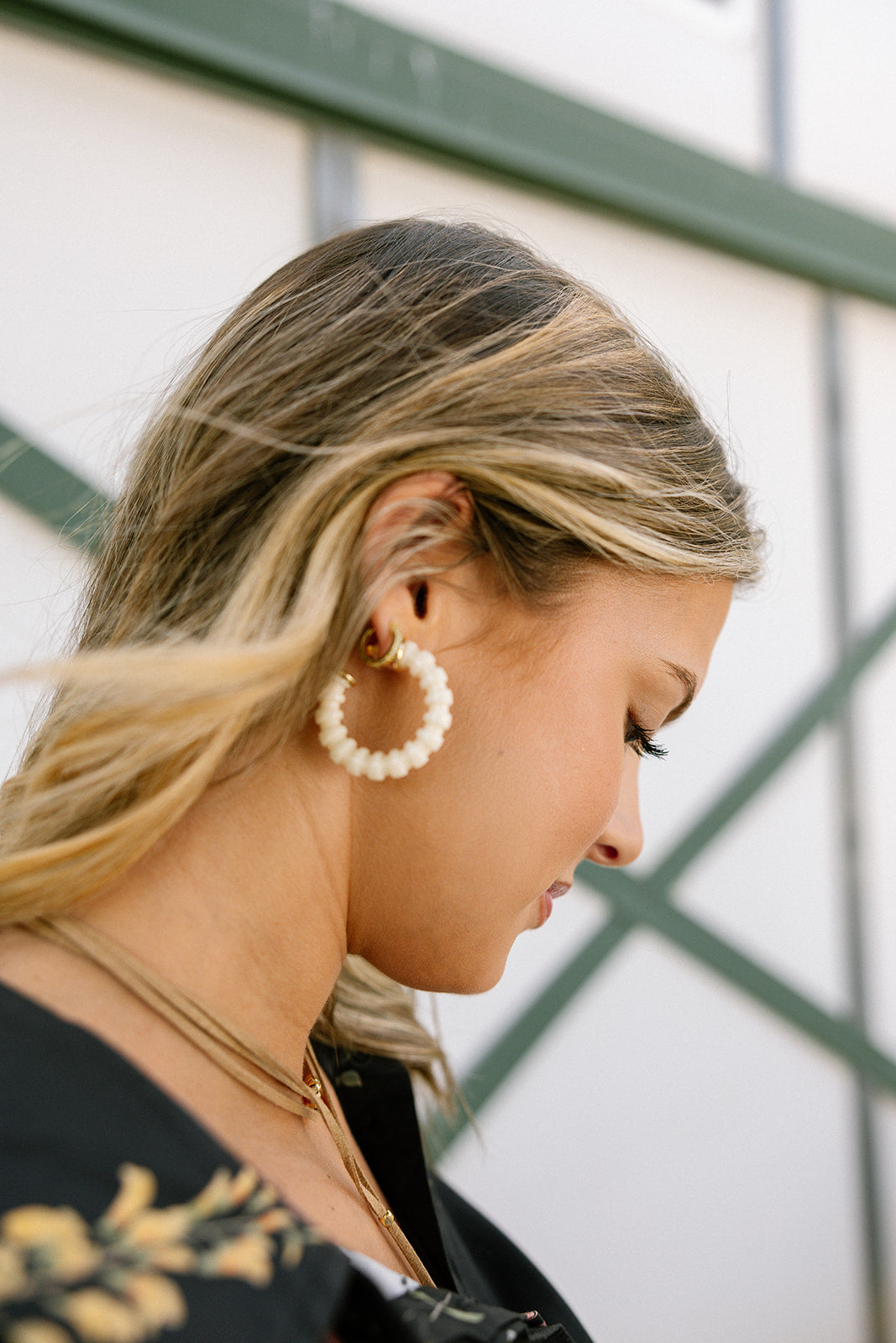 Rory Cream Ribbed Hoop Earrings - side view on model