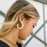 Rory Cream Ribbed Hoop Earrings - side view on model